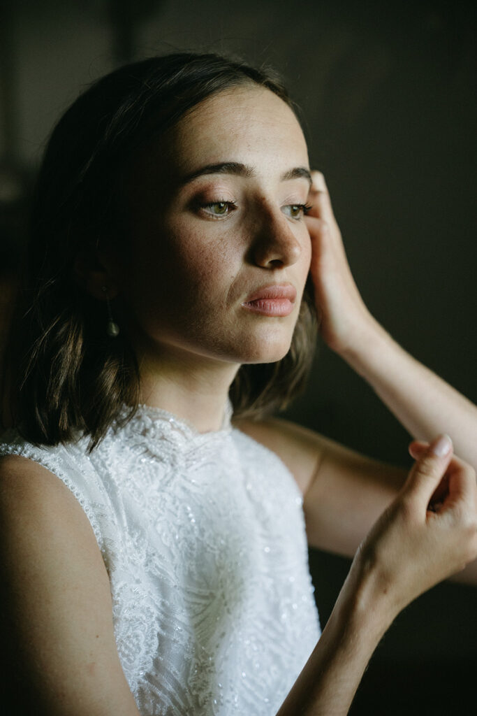 Bride getting ready in soft natural light
