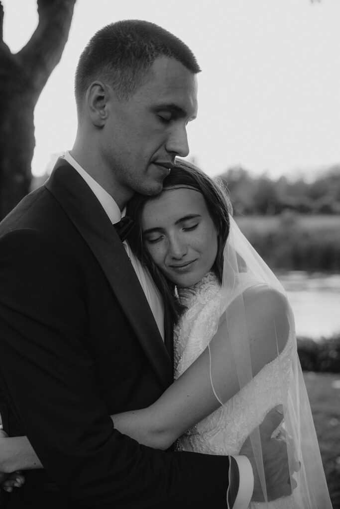 Romantic sunset portrait of bride and groom at the riverside of La Finestra Sul Fiume