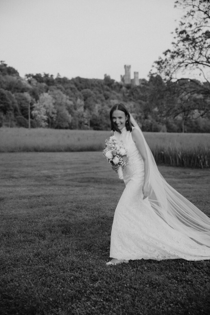 Candid bridal portrait with scenic countryside backdrop